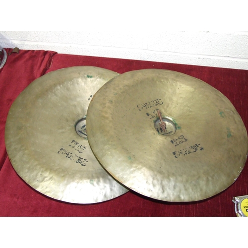 142 - A pair of Oriental beaten brass cymbals, 48cm diameter, (2).