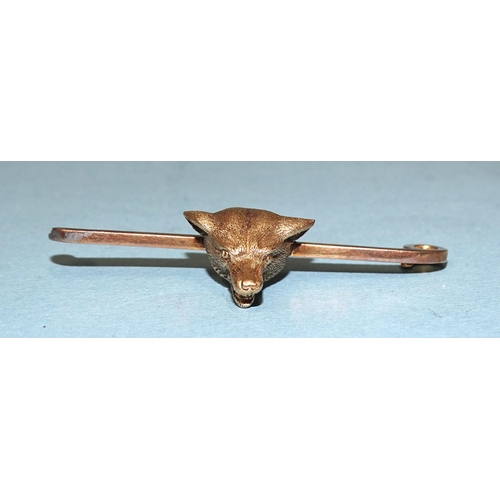 172 - A gold fox mask bar brooch marked '15ct' on bar, (pin missing), 8.9g.