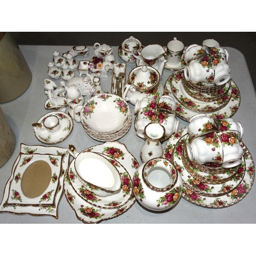 34 - Approximately eighty-five pieces of Royal Albert 'Old Country Roses' tea and dinner ware, ornaments,... 