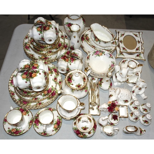 34 - Approximately eighty-five pieces of Royal Albert 'Old Country Roses' tea and dinner ware, ornaments,... 