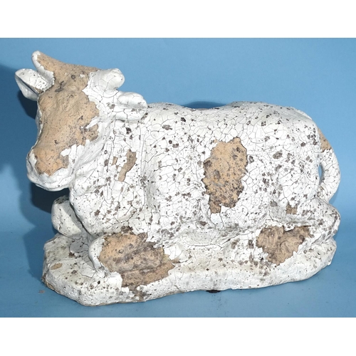 56 - A pottery model of a cow, 33cm wide, 25cm high and a tortoise carapace, (2).