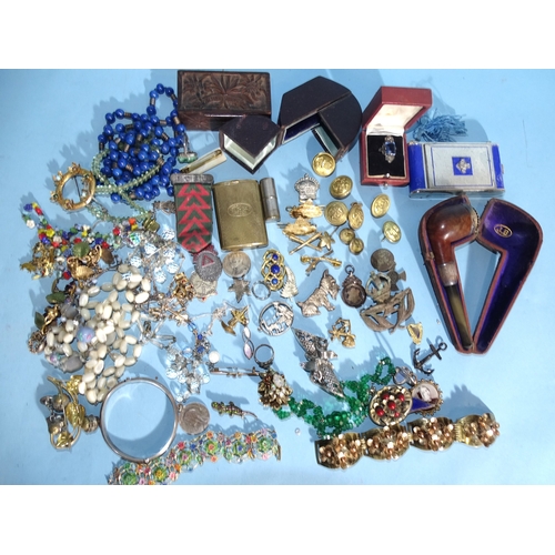 84 - A quantity of costume jewellery, badges, military badges and other items.