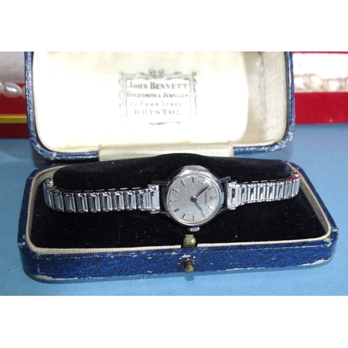 87 - A lady's Longines steel-cased wrist watch, a 9ct gold stud, 0.6g and various items of jewellery, cuf... 