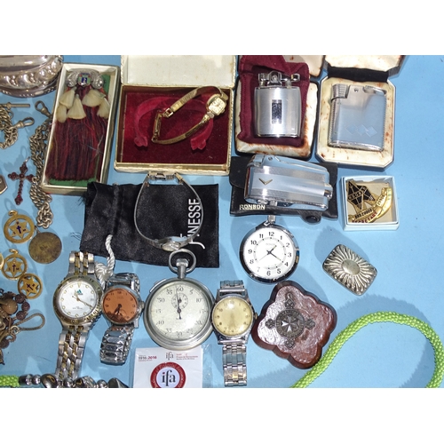 88 - A quantity of wrist watches, a Ronson table lighter, two Ronson lighters, a silver ARP lapel badge a... 