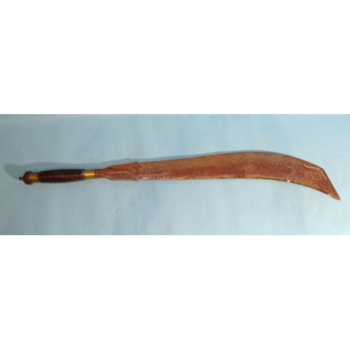 560 - An Asian knife with heavy curved steel blade embellished with brass inlay, the tip inlaid with an ey... 