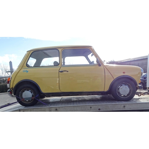 2 - A 1990 Rover Mini 1000 City E two-door saloon motor car, 1L engine, yellow paint, registration G198 ... 