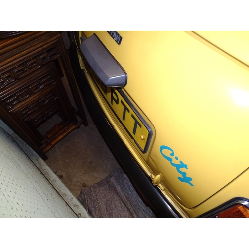 2 - A 1990 Rover Mini 1000 City E two-door saloon motor car, 1L engine, yellow paint, registration G198 ... 