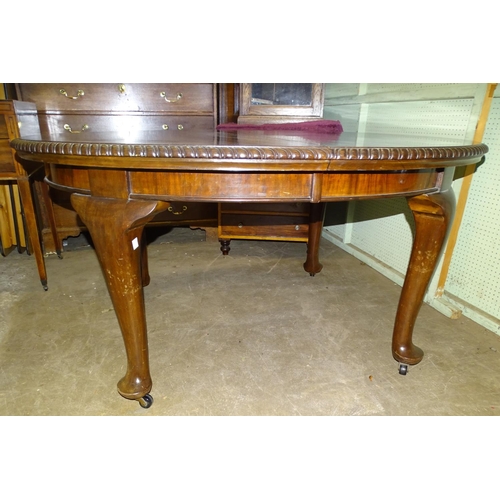 8 - A large 20th century mahogany extending oval dining table on turned legs, with two leaves, 150 x 128... 