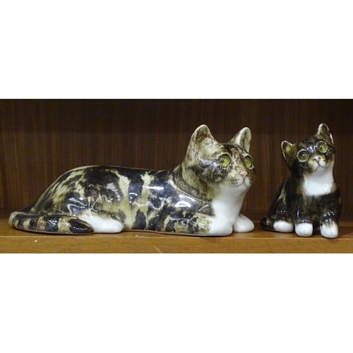 27 - A Winstanley tabby cat with glass eyes, in a recumbent pose, signed and marked 4, 26cm long, 11.5cm ... 