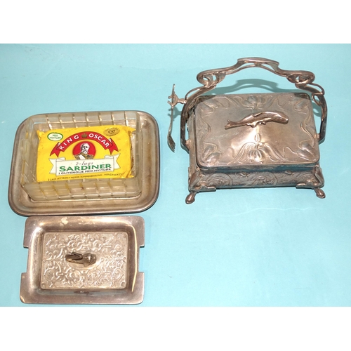 48 - A WMF plated sardine dish and cover of Art Nouveau form, with shaped handle and glass liner, embosse... 