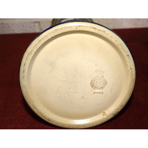 51 - A Royal Doulton stoneware vase of shouldered cylindrical form, the upper part with tube-lined stylis... 