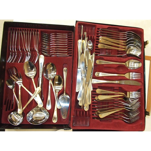 58 - A twelve-setting canteen of stainless-steel cutlery marked Princess Rostfrei, in case and two wicker... 
