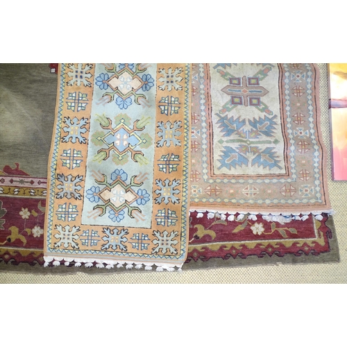 17 - A 20th century wool carpet, 277 x 360cm, (worn and damaged) and two pale-coloured wool corridor rugs... 