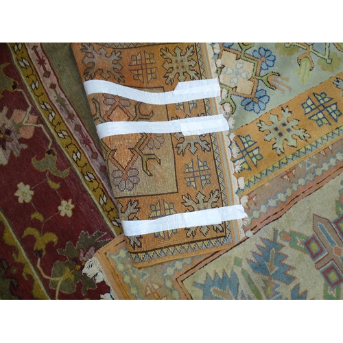 17 - A 20th century wool carpet, 277 x 360cm, (worn and damaged) and two pale-coloured wool corridor rugs... 
