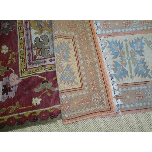 17 - A 20th century wool carpet, 277 x 360cm, (worn and damaged) and two pale-coloured wool corridor rugs... 