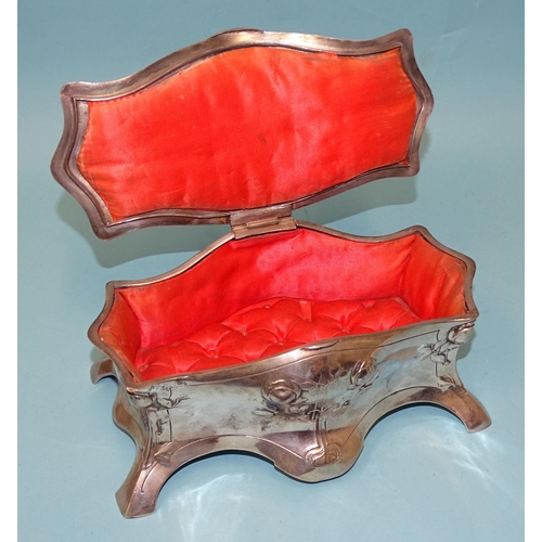 60 - A WMF silver-plated jewel casket of Art Nouveau form with hinged lid, embossed floral decoration and... 