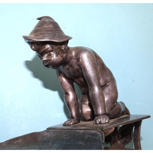 66 - A WMF silver-plated nut dish, modelled as a young boy wearing a hat, kneeling and looking at a frog ... 