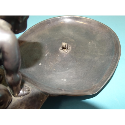 66 - A WMF silver-plated nut dish, modelled as a young boy wearing a hat, kneeling and looking at a frog ... 