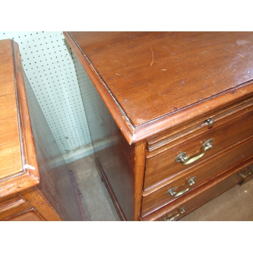 45 - A pair of Georgian-style mahogany bachelors' chests, each with brushing slide above three drawers, o... 