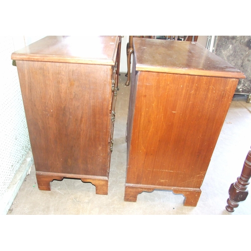 45 - A pair of Georgian-style mahogany bachelors' chests, each with brushing slide above three drawers, o... 