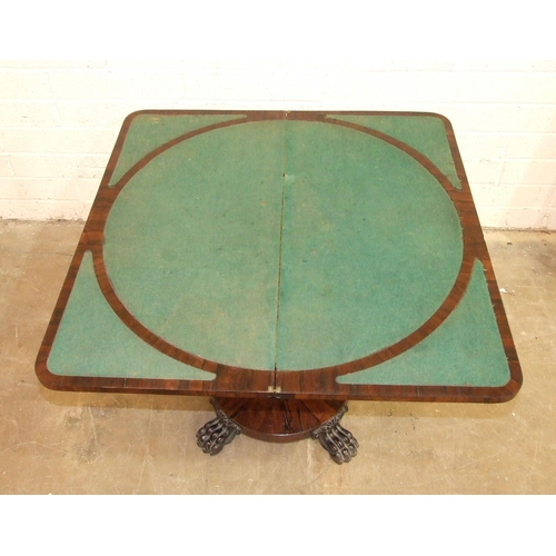 57 - An early-19th century rosewood fold-over card table with central circular baize and baize-lined span... 