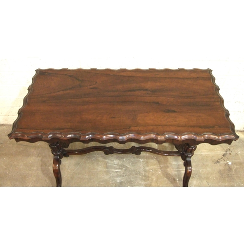 58 - A 19th century rosewood centre table, the rectangular top with moulded edge, on two end columns and ... 