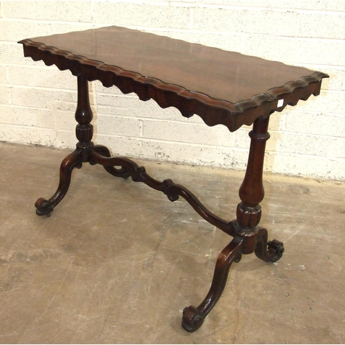 58 - A 19th century rosewood centre table, the rectangular top with moulded edge, on two end columns and ... 