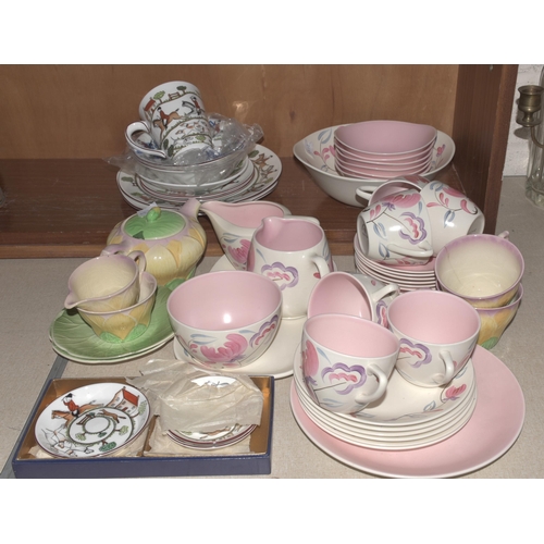 48 - A Crown Devon tea service decorated with pastel colours, approximately eighteen pieces, six each Sus... 