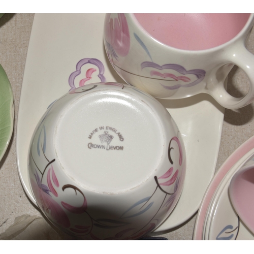 48 - A Crown Devon tea service decorated with pastel colours, approximately eighteen pieces, six each Sus... 