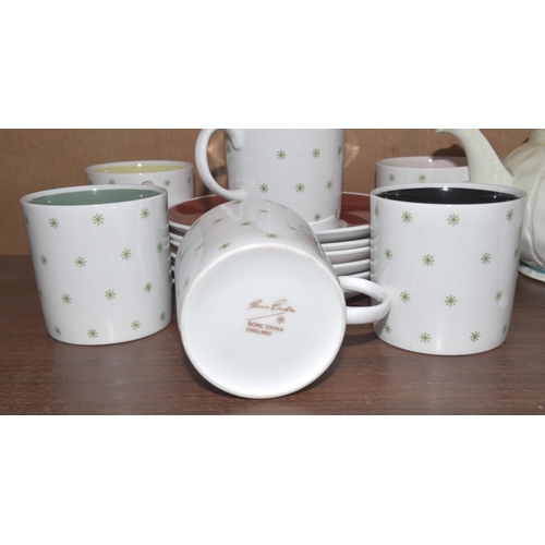 48 - A Crown Devon tea service decorated with pastel colours, approximately eighteen pieces, six each Sus... 