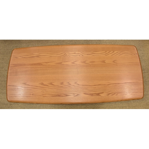 7 - An Ercol 'Windsor' rectangular two-tier coffee table with rounded corners, 128 x 55cm.... 