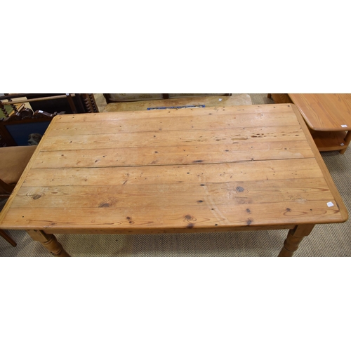8 - A pine kitchen table on turned legs, 152 x 81cm.