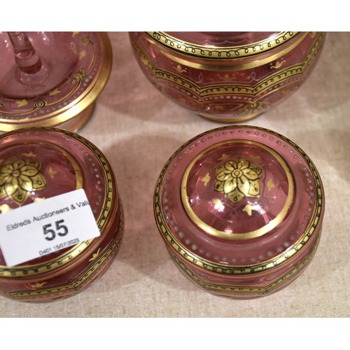 55 - Six items from a cranberry and gilt-decorated dressing table set, (no tray), a yellow glass decanter... 