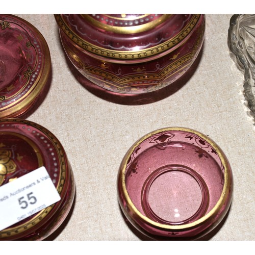 55 - Six items from a cranberry and gilt-decorated dressing table set, (no tray), a yellow glass decanter... 