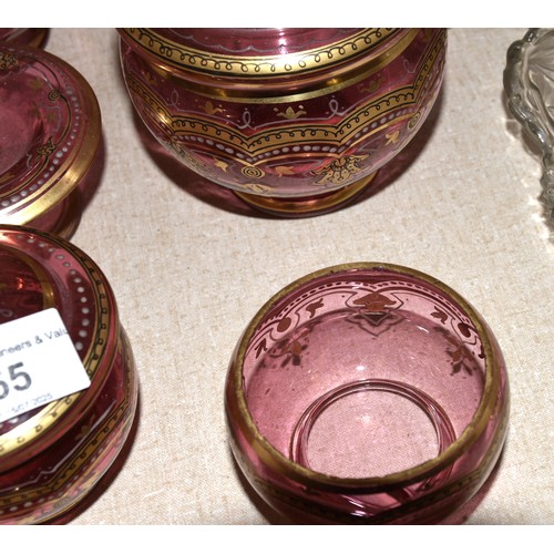 55 - Six items from a cranberry and gilt-decorated dressing table set, (no tray), a yellow glass decanter... 
