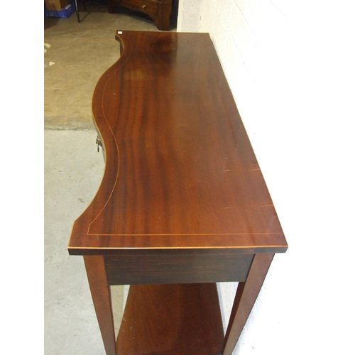 37 - A good-quality inlaid cross-banded mahogany serpentine serving table, the top above three shaped fri... 