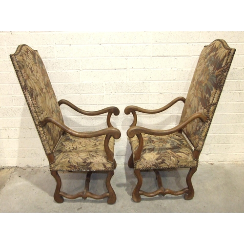 39 - A pair of antique Continental walnut-framed high-back armchairs with downswept arms and shaped legs ... 