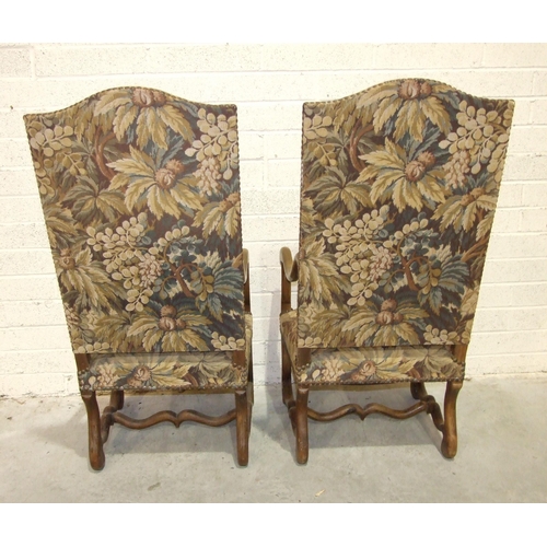 39 - A pair of antique Continental walnut-framed high-back armchairs with downswept arms and shaped legs ... 