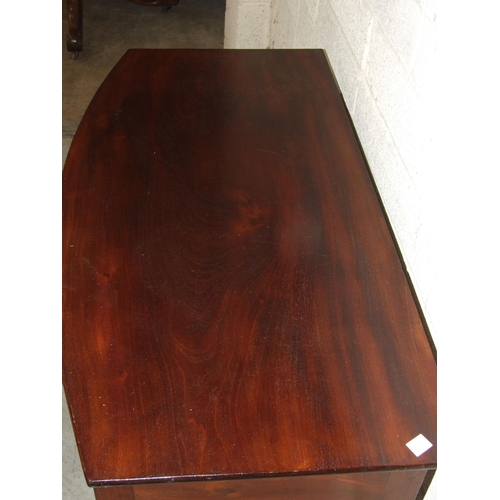 42 - A late-Georgian mahogany bow-fronted side table, the two oak-lined serpentine frieze drawers on turn... 