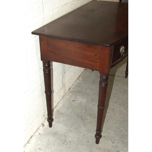 42 - A late-Georgian mahogany bow-fronted side table, the two oak-lined serpentine frieze drawers on turn... 