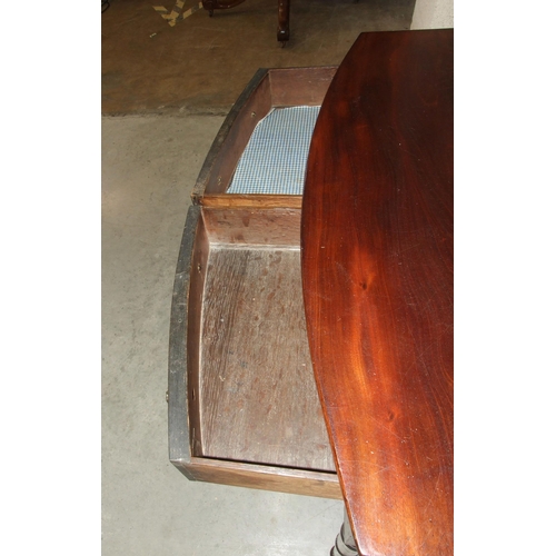 42 - A late-Georgian mahogany bow-fronted side table, the two oak-lined serpentine frieze drawers on turn... 