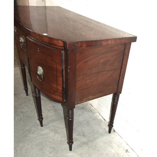 47 - A George IV mahogany and ebony-inlaid sideboard with slightly-bowed outline, having a pair of cupboa... 