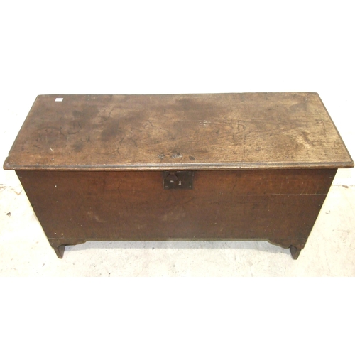 36 - An antique oak six-plank coffer, with old lock and strap hinges, 108cm wide.
