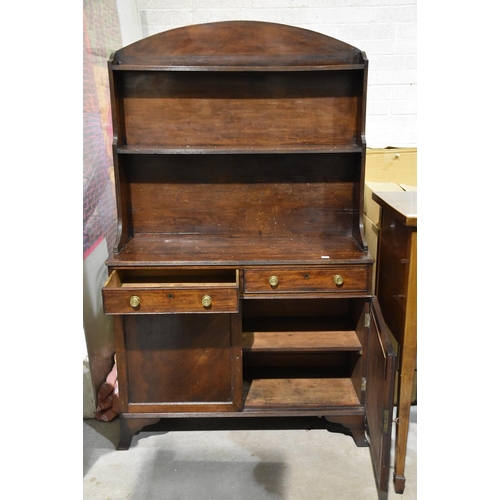 1 - An antique mahogany small dresser, having two shelves above two drawers and a pair of cupboard doors... 