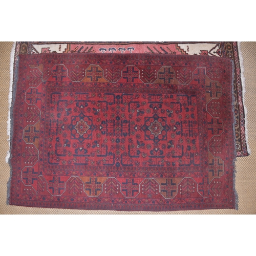 72 - An Oriental rug, 150 x 107cm and two other rugs, (3).