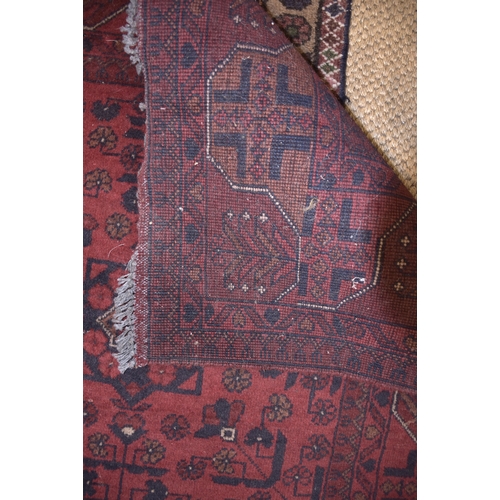 72 - An Oriental rug, 150 x 107cm and two other rugs, (3).