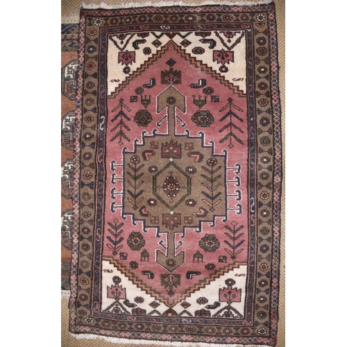 72 - An Oriental rug, 150 x 107cm and two other rugs, (3).