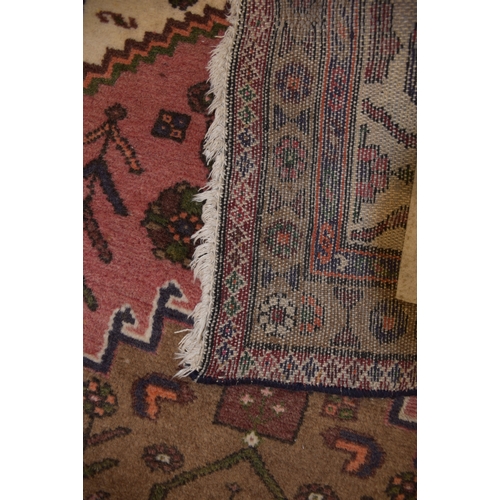 72 - An Oriental rug, 150 x 107cm and two other rugs, (3).