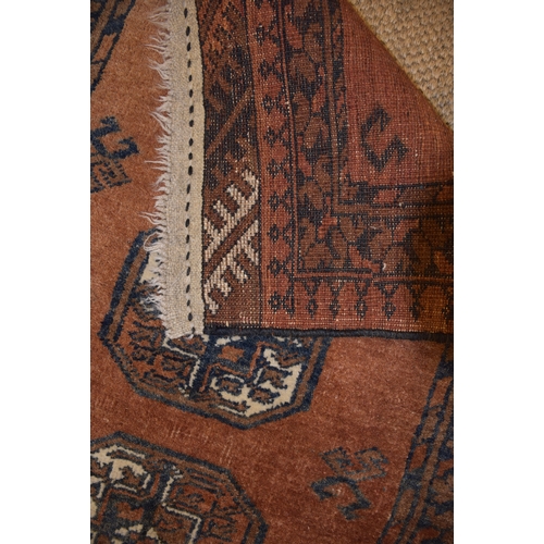 72 - An Oriental rug, 150 x 107cm and two other rugs, (3).