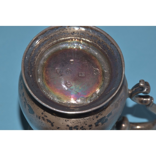 10 - A George III small silver tankard of waisted form, with 'C'-scroll handle, London 1786, maker John L... 